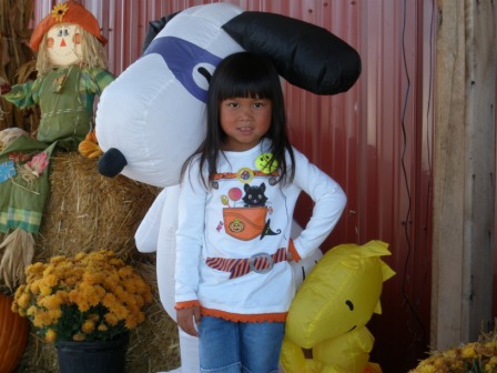 Kasen with Snoopy at pumpkin patch